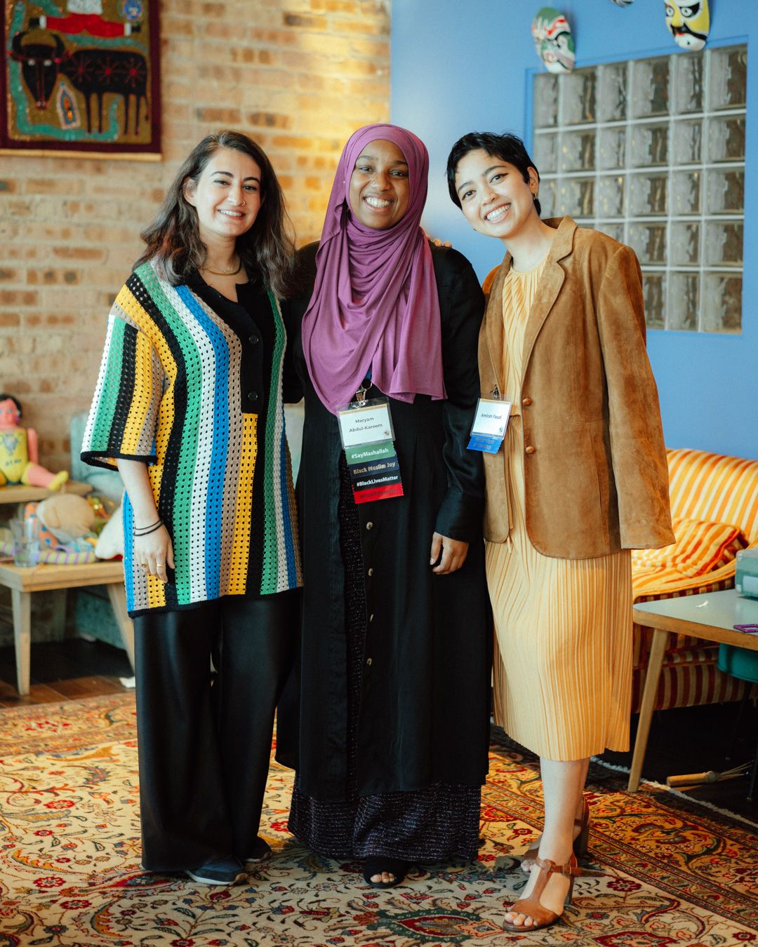 A photo of the Pillars Catalyze Fund team smiling with their arms around each other, featuring Program Associate Mawish Raza, Senior Manager Maryam Abdul-Kareem, and Program Director Amirah Fauzi